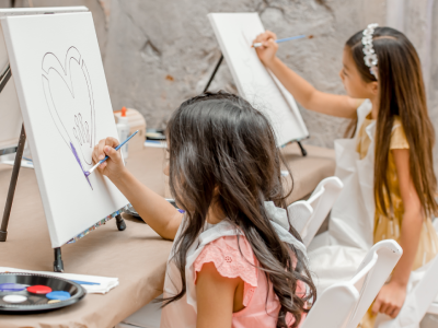 Children painting on a canvas