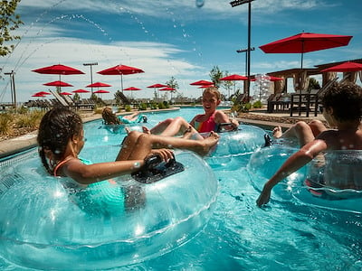 Kids in Lazy River at Arapahoe Springs at Gaylord Rockies
