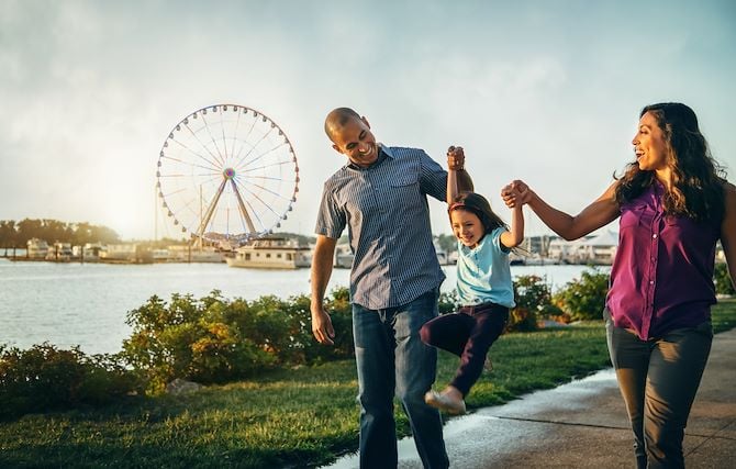 Family walking on National Harbor Waterfront near Gaylord National