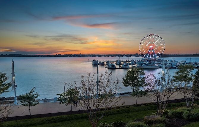 Sunset view of National Harbor, MD with Capital Wheel in background