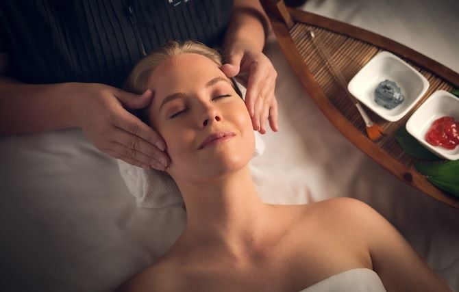 Woman getting face massage at Relache Spa at Gaylord National