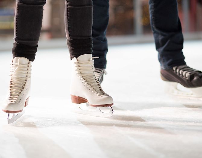 Couple's ice skates on rink