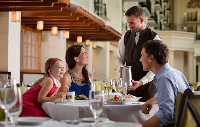 Family at dining table at Ravello restaurant at Gaylord Opryland