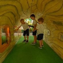 3 Kids in log tunnel at Gaylord Opryland Resort in Nashville, TN