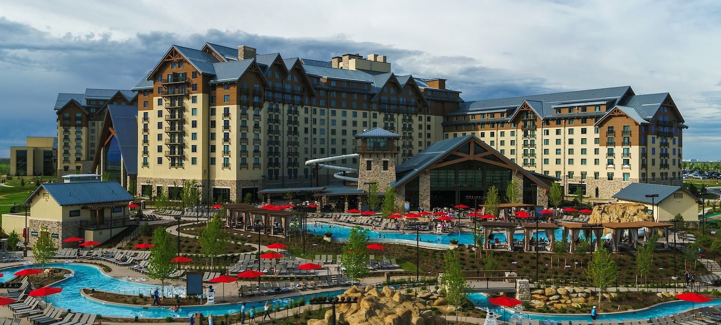 Arapahoe Springs Lazy River in front of Gaylord Rockies exterior