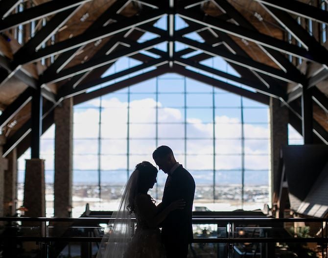 Couple in an embrace in Grand Lodge at Gaylord Rockies Resort in Aurora, CO