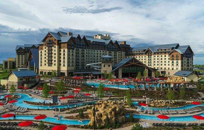 Arapahoe Spring Lazy river in front of Gaylord Rockies exterior