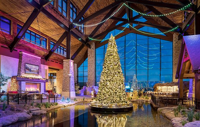 Gaylord Rockies Grand lodge with Christmas Tree and view of Rocky Mountains