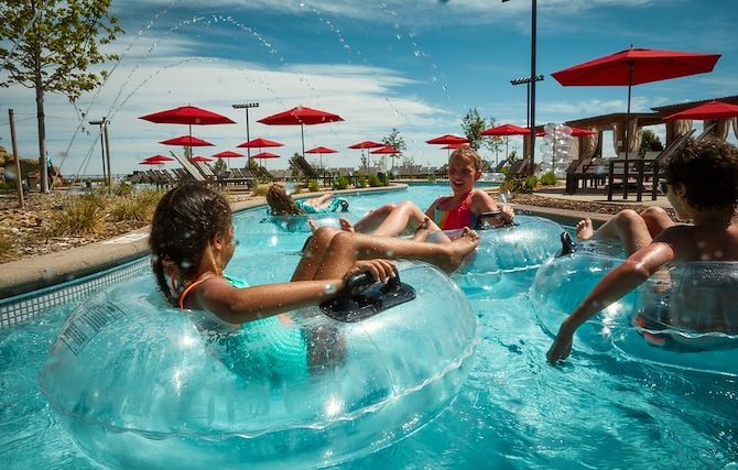 Kids in tubes on lazy river at Arapahoe Springs at Gaylord Rockies