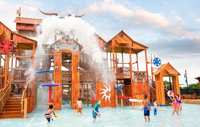 Kids in water in front of Treehouse at Paradise Springs Water Park