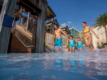 Family in water at Cypress Springs Water Park at Gaylord Palms